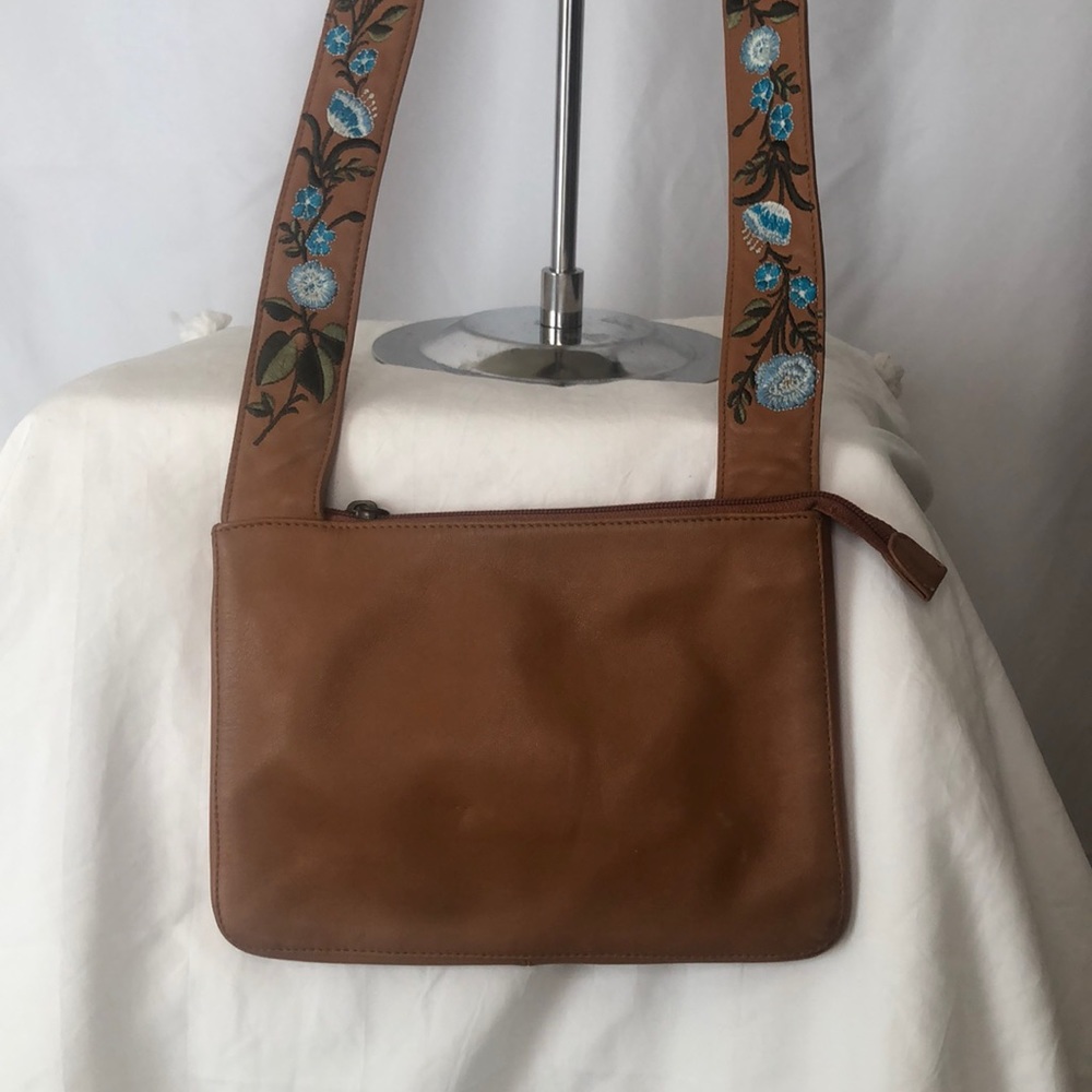 CASLON light brown crossbody with floral embroidered straps.